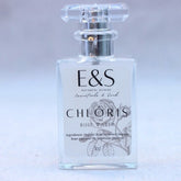 Rose hydrosol bottle, clear glass, silver cap, Chloris label with rose graphic
