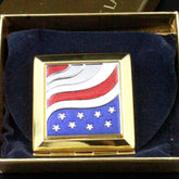 Face powder compact gold square case with American flag design and Esteé Lauder text