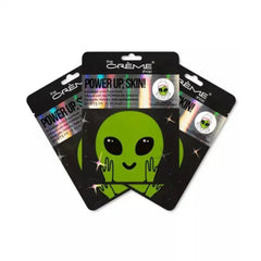 Alien face mask with green alien graphic, black packaging, and "POWER UP, SKIN!" text from the Crème Shop