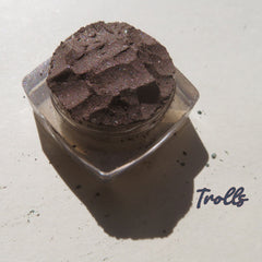 Rich dark brown vegan loose mineral eyeshadow with shimmer pigment in a small round jar, cruelty-free.