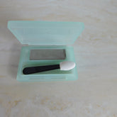 Eye makeup Clinique eyeshadow in gray with applicator, in a light green plastic case