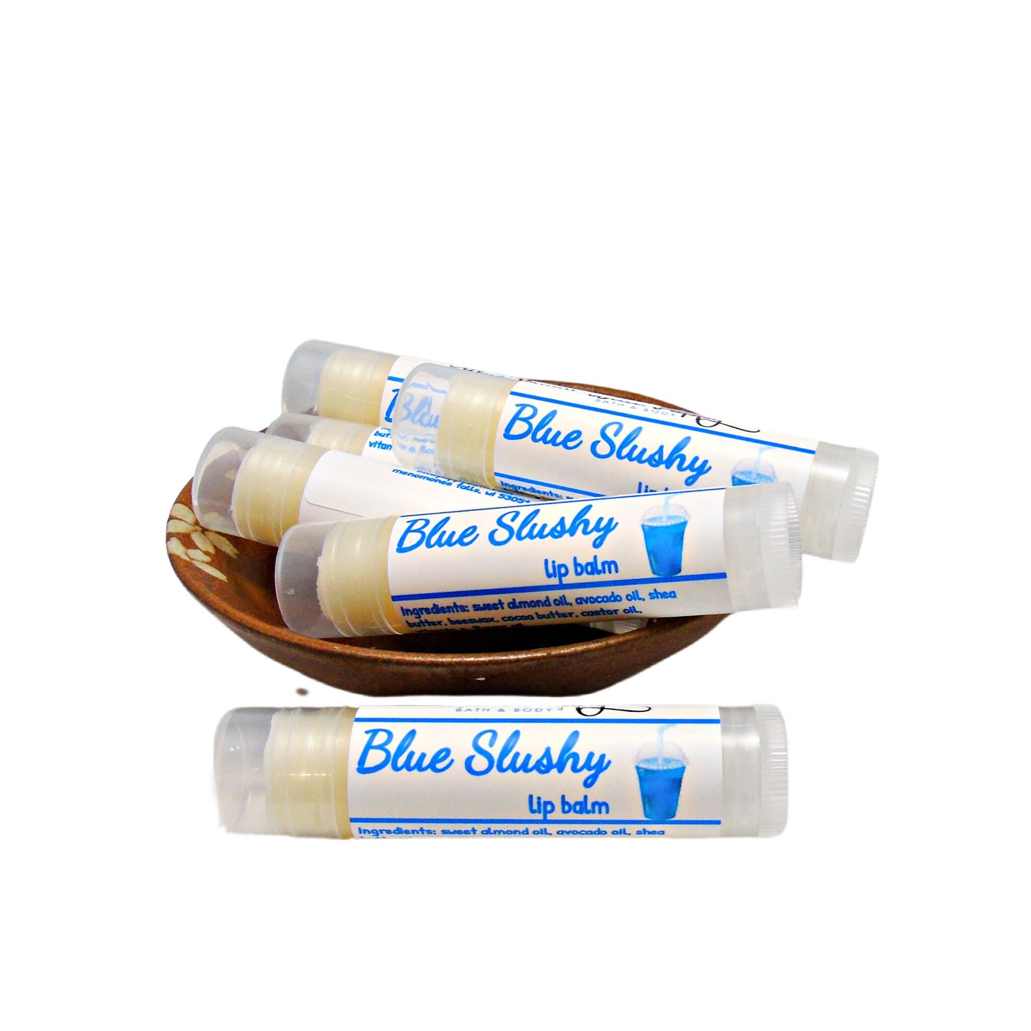 Lip balm tubes with blue and white labels, clear plastic caps, and Blue Slushy text on tubes
