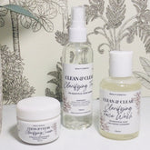 Face Moisturizers, white jars and bottles with Clean & Clear labels, on a white surface