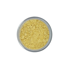 Yellow powder in a clear plastic container, top view, granular texture
