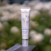 Eye makeup activating cream, white tube, silver cap, Nu Skin LumiSpa IdealEyes brand name visible