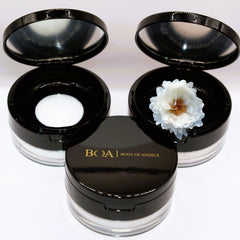 Powder compacts with black lids, clear base, and BOA Body of Angels text