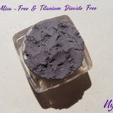 Eyeshadow pigment, matte medium gray, loose powder in clear container