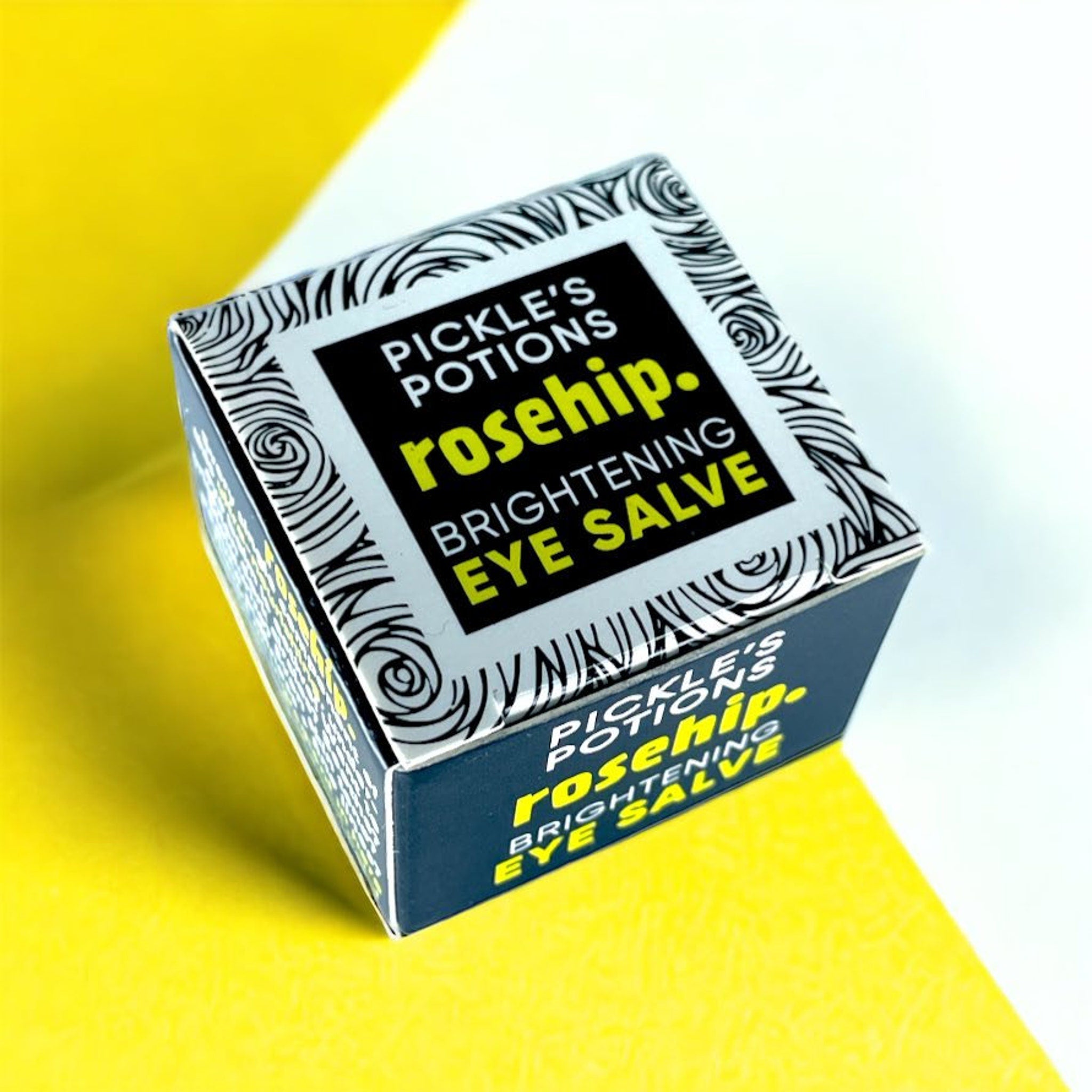 Eye makeup product box, black and white swirl pattern, Pickle's Potions Rosehip Brightening Eye Salve