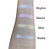 Single pressed eyeshadow pan with duo chrome finish shifting between soft pink and gold tones