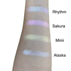 Single pressed eyeshadow pan with duo chrome finish shifting between soft pink and gold tones