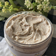 Body scrub with beige and brown speckled texture in a clear jar, Beekeeper's BEST label visible