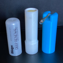 Lip balm holder, white and blue plastic, Blistex Deep Renewal with lip balm visible