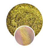 Eye makeup product with gold shimmer and texture, shown swatched on skin