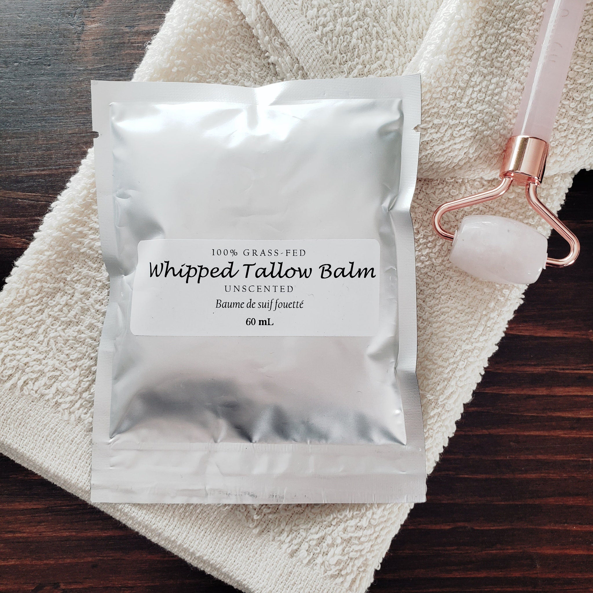 White recyclable jar of whipped grass-fed tallow balm with minimalist label and creamy texture