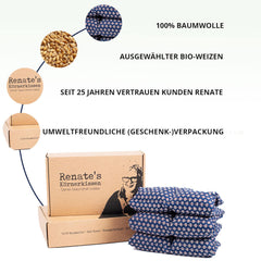 Körnerkissen blue patterned fabric with text, stacked on cardboard box, Renate's brand visible
