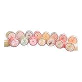 Lip balms in various colors and flavors, round containers with labels, ForeverFireweedGifts brand