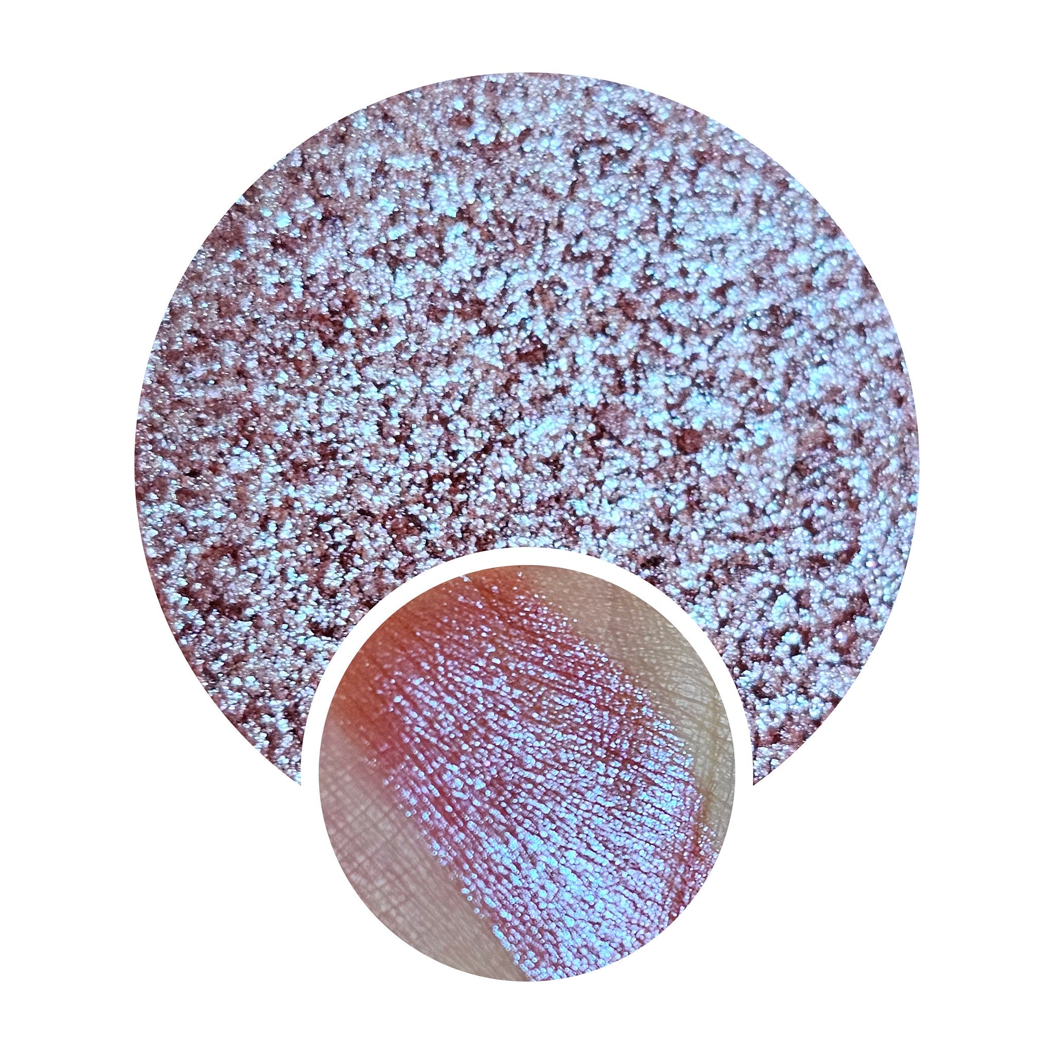Eye makeup shimmery duochrome eyeshadow with blue and pink sparkle, applied on skin
