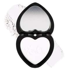 Powder compact with black case, white powder, and heart shape with KimChi text visible