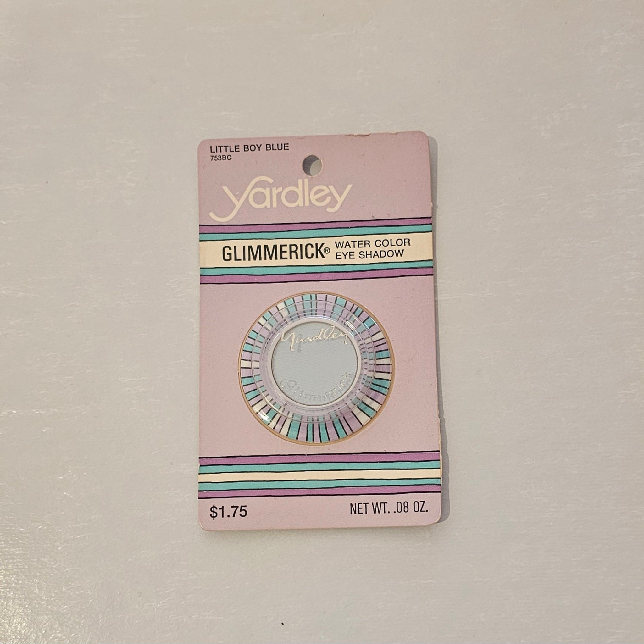 Eye makeup Yardley Glimmerick in Little Boy Blue, on pink card with striped accents and text