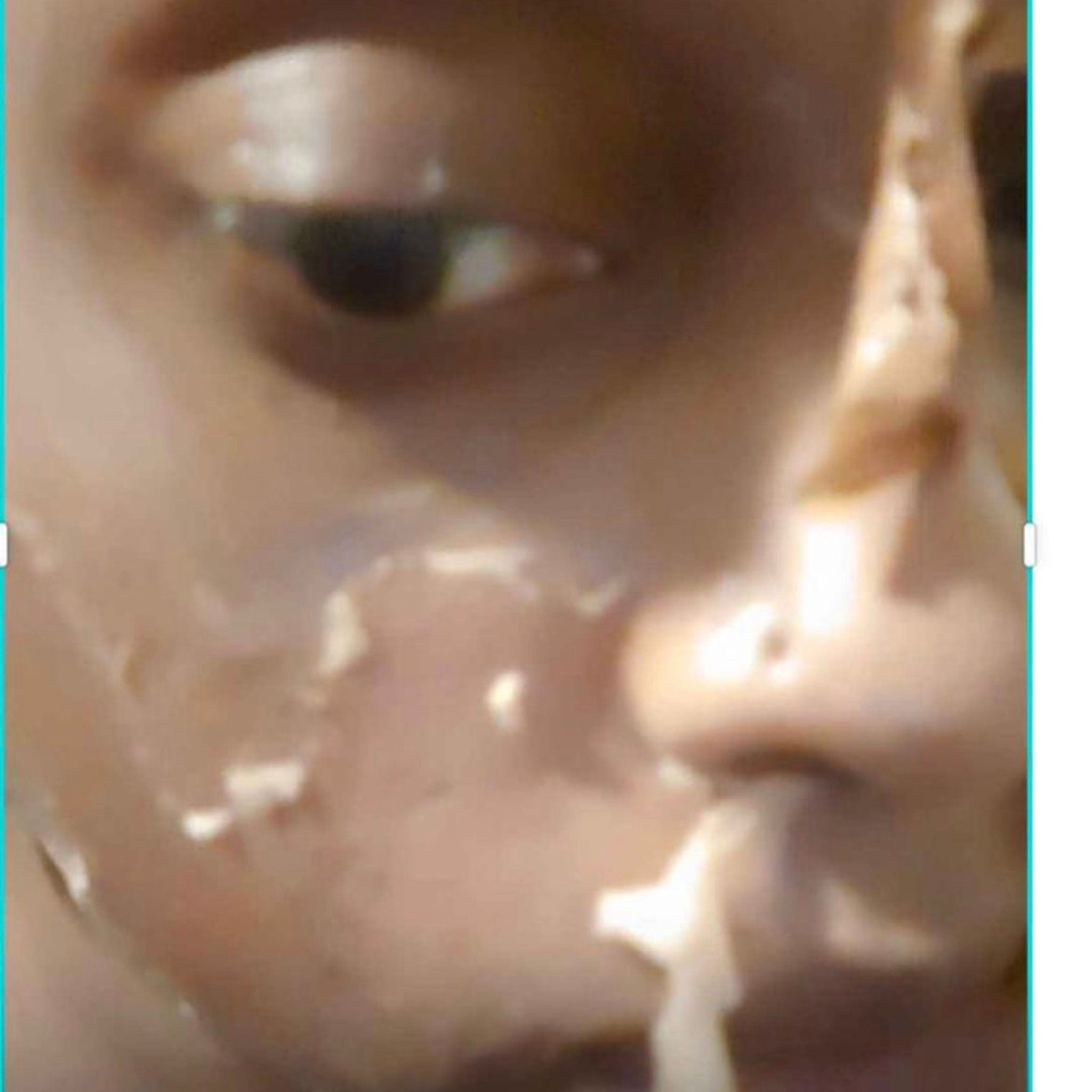 Amber glass bottle of yellow peeling facial oil with dropper applicator on white background