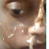 Amber glass bottle of yellow peeling facial oil with dropper applicator on white background