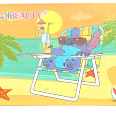 Open blue eyeshadow palette displaying 18 vibrant shades from navy to teal in matte and shimmer finishes