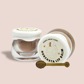 Lip balm jars with white lids, brown balm, and Genki Skin Care label with text and illustration