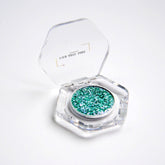Eyeshadow single with teal and silver shimmer in clear hexagonal compact, Manifesto brand