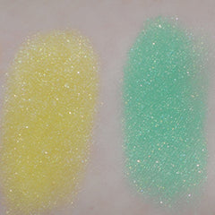 Side view of pink mineral eye shadow jar with sifter, showing product depth and matte finish