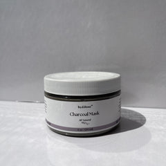 Charcoal mask jar, white plastic lid, gray label, byd.Rose branding, All Natural text