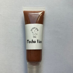 Lip gloss tube with brown gloss, white label, and clear plastic cap, Glossy New You Mocha Kiss