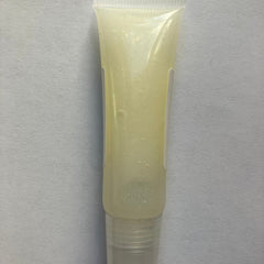 Lip gloss tube with clear plastic, pale yellow color, and a pearlescent shimmer