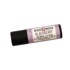 Lip balm tube with purple floral pattern, black cap, and Wild Rose Blackberry label