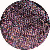 Vibrant pink and silver eye shadow palette with geometric packaging design, showcasing shimmering shades in rectangular pans.