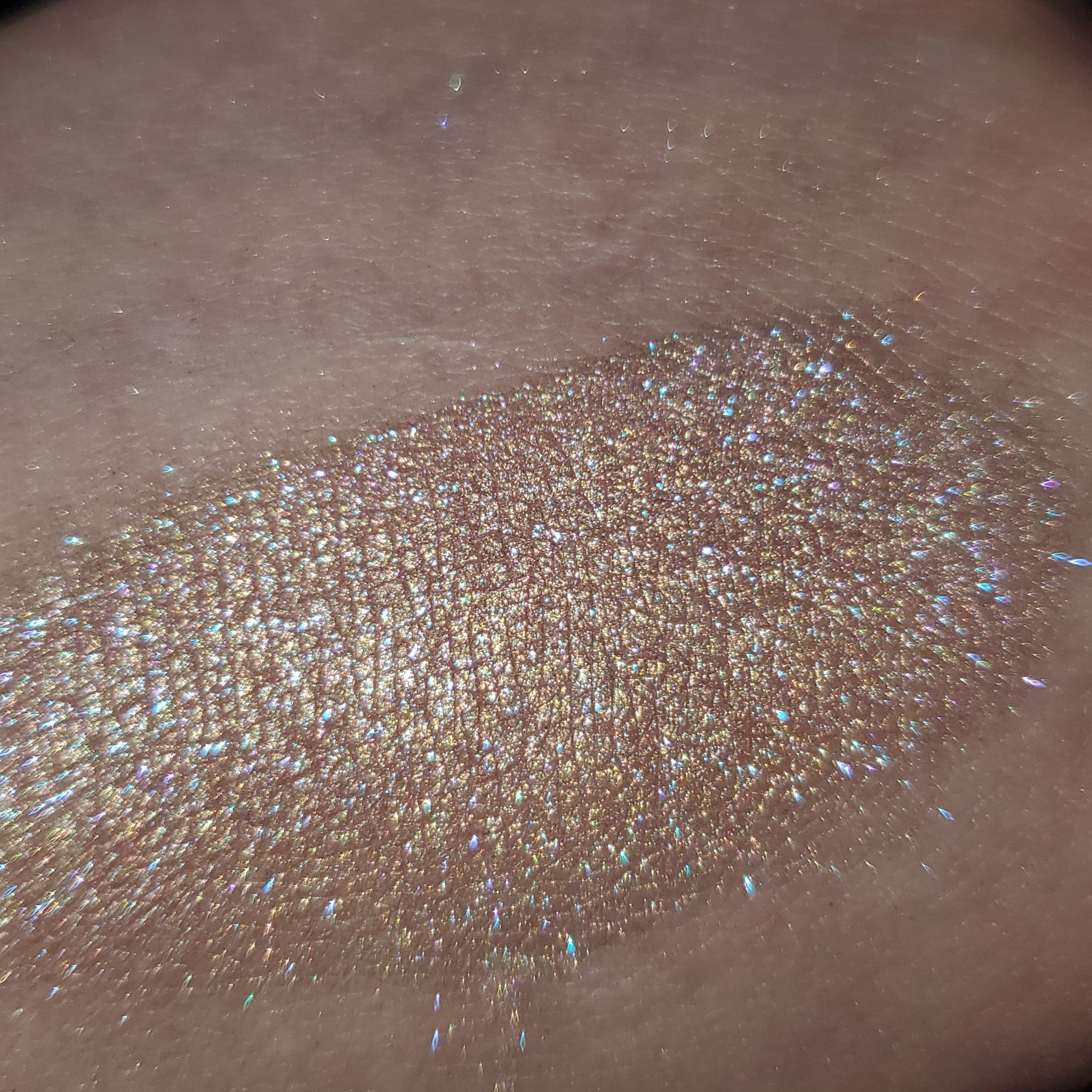 Close-up of Stay Cool, Bret Eye Shadow in a sleek black compact with vibrant teal powder shimmer.