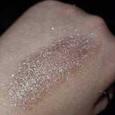 Vibrant fan art-inspired eye shadow palette with bold colors in sleek black compact packaging