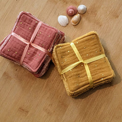 Close-up of reusable cotton and bamboo skincare wipes showing soft texture with visible fibers in natural tones