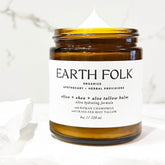 Luxury glass jar of grass-fed tallow moisturizer with olive, shea, and aloe, showcasing rich cream texture