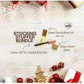 Body balm set with wooden lids, clear bottles, and Wildebody logo on white wood background