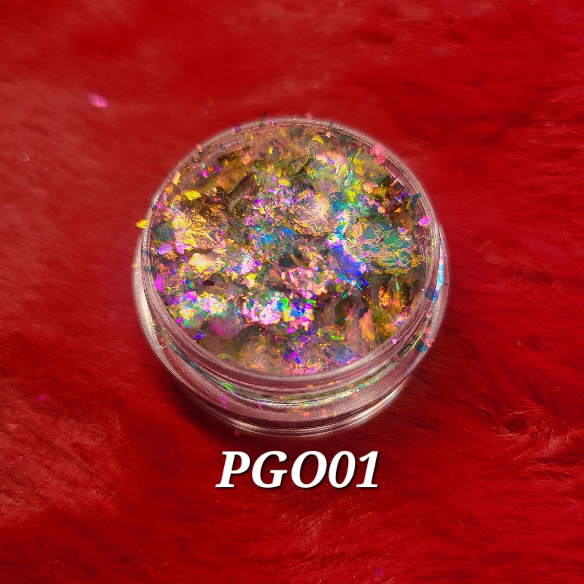 Close-up of Flakes Eye Shadow in shade PGO01, showcasing its shimmering powder texture and compact case design