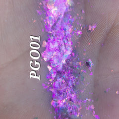 Close-up of shimmering bronze Flakes Eye Shadow with reflective flecks in compact palette