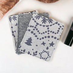 Reusable face pads, gray patterned fabric with tree and star designs, textured material