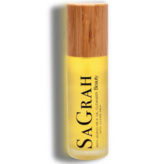 Facial Cleanser bottle with yellow liquid, wooden cap, and SaGrah Beauty text