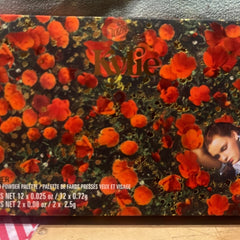 Eye makeup palette with orange floral pattern and Kylie Cosmetics logo