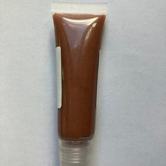 Lip gloss tube with brown color, clear plastic tube, and white label for application