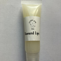 Lip gloss tube with clear, sparkly, yellow liquid, and "Diamond Lips" text label