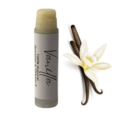 Lip balm tube with light yellow balm, grey label with "Vanilla" text, and vanilla flower and pods