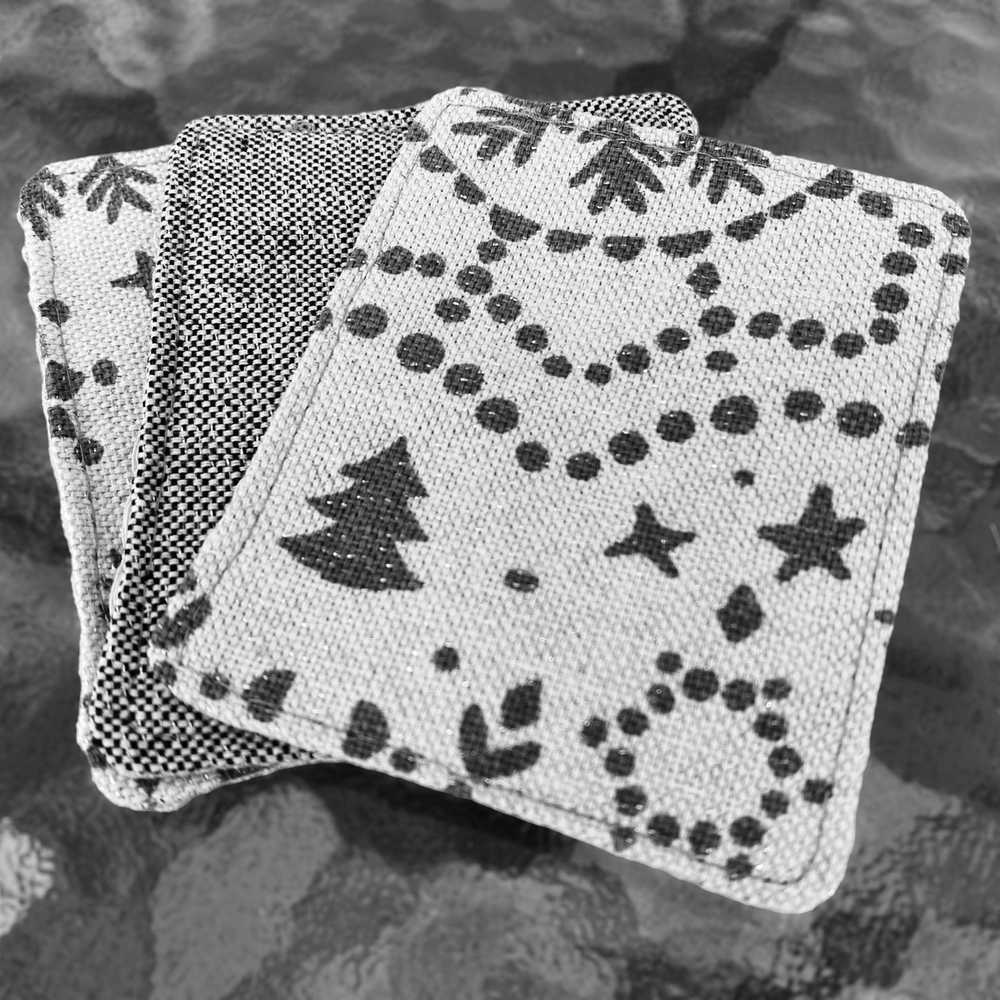 Makeup remover pads, gray and white fabric with festive print, stacked together