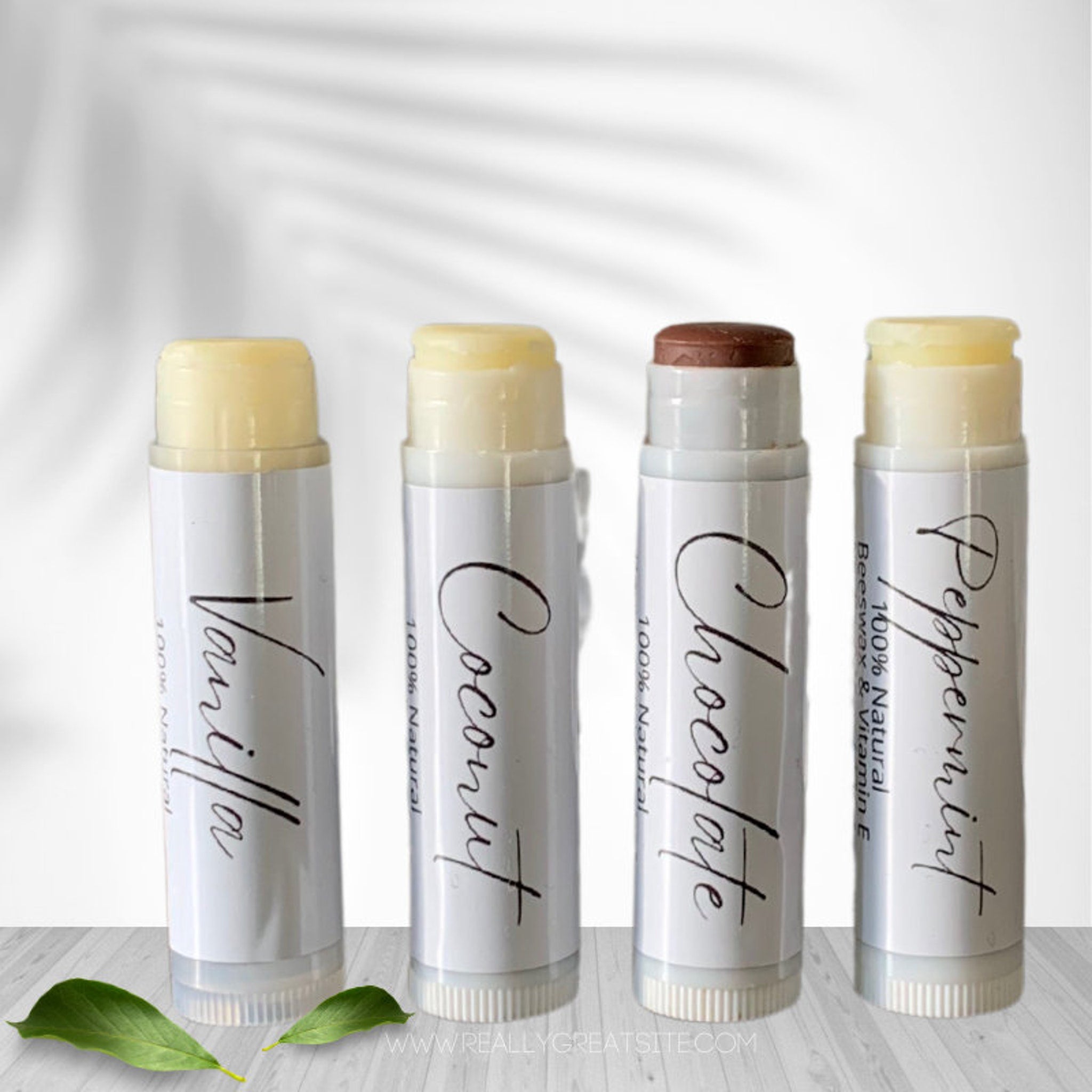 Lip balms, white tubes with flavors, vanilla, coconut, chocolate, peppermint, Veda Essential Canada
