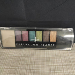 Close-up of a hand applying black eyeliner along the upper lash line for precise definition